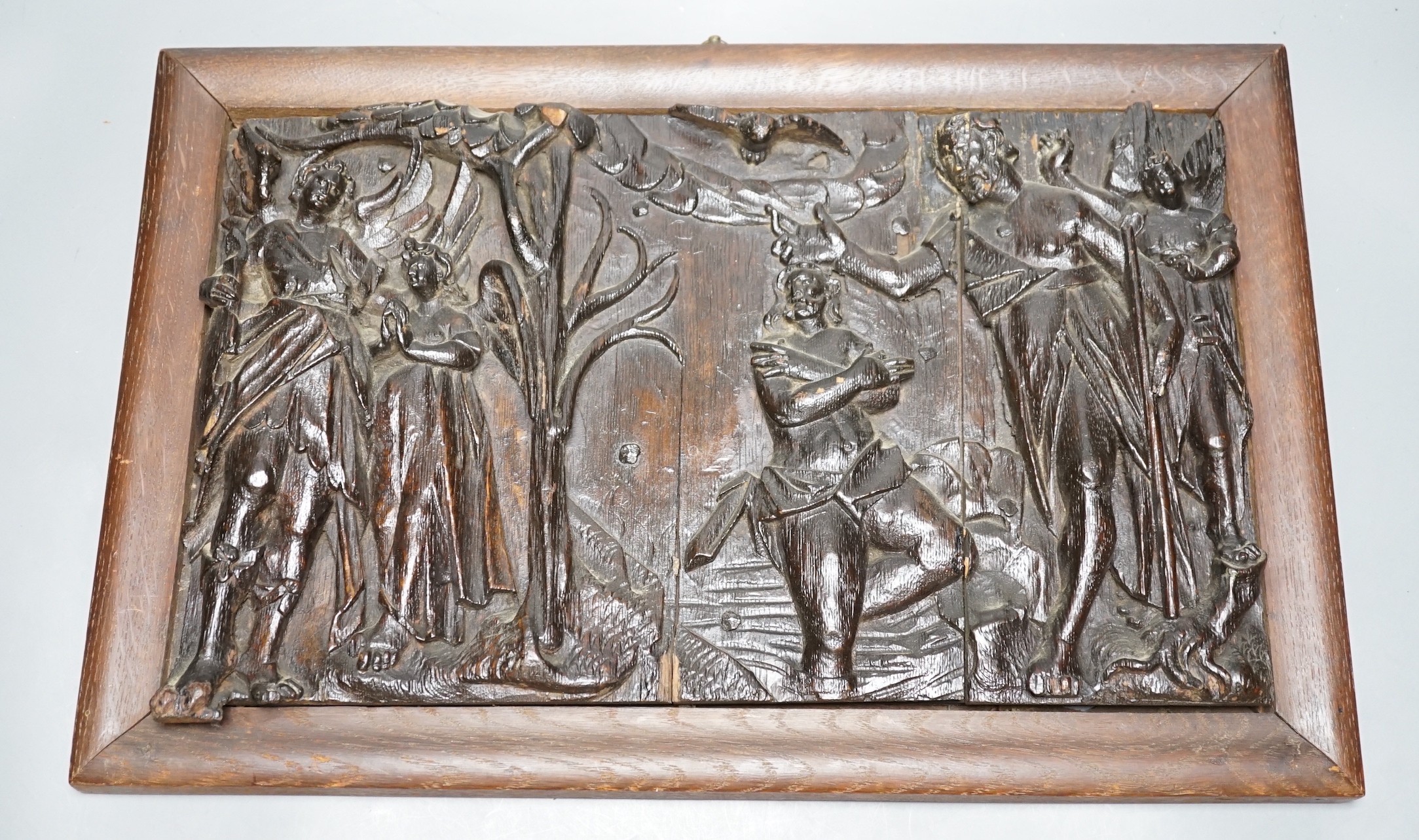 An antique rectangular carved oak panel, later frame, 25x40cm excl frame